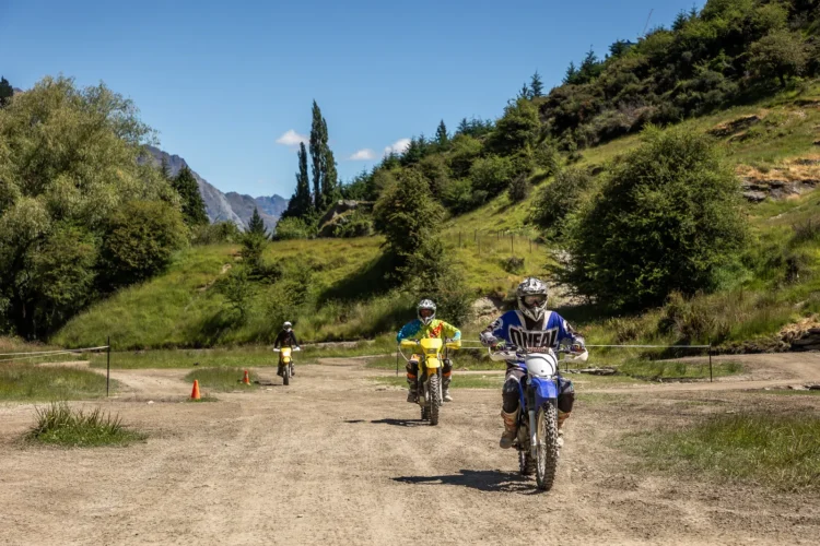 Riders learning to ride on dirt bikes